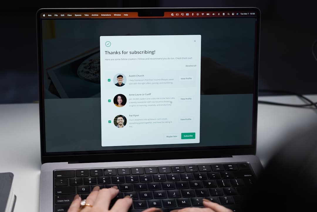 Person typing on a laptop keyboard